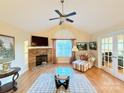 Spacious living room with a fireplace and hardwood floors at , Charlotte, NC 28269