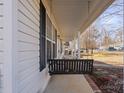 Covered porch with a swing, offering relaxing outdoor space at 1013 Ashwood Pl, Salisbury, NC 28146