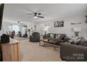 Spacious living room with comfy sofas and ceiling fan at 1013 Ashwood Pl, Salisbury, NC 28146