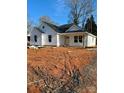 Newly built home features white siding, dark roof, and a front porch at 1200-1 Stanton Dr, Shelby, NC