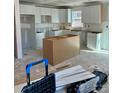 Modern kitchen with white cabinets, an island, and ample counter space at 1200-1 Stanton Dr, Shelby, NC