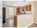 Kitchen features granite countertops and stainless steel appliances at 13502 Tartarian Ct, Charlotte, NC 28215