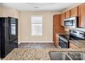 Kitchen features granite countertops and stainless steel appliances at 13502 Tartarian Ct, Charlotte, NC 28215