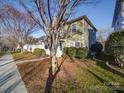 Two-story house with green siding, visible from the street at 18618 The Commons Blvd, Cornelius, NC 28031