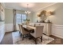 Bright dining room with hardwood floors, decorative mirror, and chandelier at 1980 Copper Path Dr, Fort Mill, SC 29715