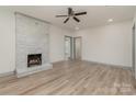 Living room with fireplace, hardwood floors, and ceiling fan at 207 Faulkner St, Clover, SC 29710