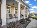 Inviting front porch with two chairs and brick flooring at 228 Pinnacle Xing, Shelby, NC 28152