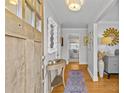 Bright and airy entryway with hardwood floors and a stylish console table at 4526 Wedgewood Dr, Charlotte, NC 28210