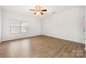 Bright living room with hardwood floors and ceiling fan at 611 Cahill Ln, Fort Mill, SC 29715