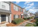 Townhome community with brick exteriors and walkway at 8044 Sapwood Ct, Matthews, NC 28104