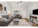 Spacious living room with hardwood floors and a cozy sitting area at 8146 Rudolph Rd, Charlotte, NC 28216