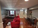 Spacious living room featuring hardwood floors and ample natural light at 9323 Lenox Pointe Dr, Charlotte, NC 28273