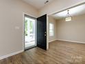 Entryway with hardwood floors and view of front porch at 104 Pratt St, Belmont, NC 28012