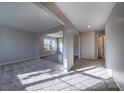 Bright hallway with carpeted floors and views into adjacent rooms at 10502 Haddington Nw Dr, Charlotte, NC 28269