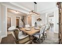 Bright dining room featuring a rustic wooden table and chandelier at 12014 Grey Partridge Dr, Charlotte, NC 28278