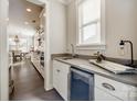 Modern kitchen with white cabinets, wine cooler, and granite countertops at 12014 Grey Partridge Dr, Charlotte, NC 28278