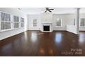 Bright living room featuring hardwood floors and a fireplace at 14916 Oregon Oak Ct, Mint Hill, NC 28227