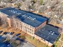 Aerial view of brick building and parking lot at 201 S Hoskins Rd # 122, Charlotte, NC 28208