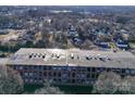 Aerial view of brick building and surrounding area at 201 S Hoskins Rd # 122, Charlotte, NC 28208