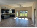 Open concept kitchen and living area with an island and stainless steel appliances at 226 Beths Ct, York, SC 29745