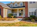 Front entrance with porch and landscaping at 415 Cameron Dr, Salisbury, NC 28147