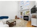 Spacious living area with fireplace and high ceilings at 420 Queens Rd # 6, Charlotte, NC 28207