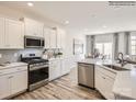 Modern kitchen with stainless steel appliances and white cabinetry at 4580 Potters Wheel Dr, Fort Mill, SC 29715