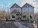 Two-story house with stone and siding exterior at 600 E Monbo Rd, Statesville, NC 28677