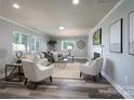 Spacious living room with hardwood floors, fireplace, and neutral color palette at 6211 Rock Island Rd, Charlotte, NC 28278