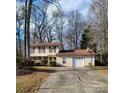 Two-story house with attached garage and long driveway at 6619 Wagon Oak Rd, Charlotte, NC 28212