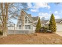 Gray A-frame house with stone accents and a deck at 9175 Cox Rd, Mount Pleasant, NC 28124