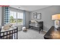 Charming Bedroom with ample natural light, featuring a crib, changing table, and serene decor for a cozy atmosphere at 1058 Horizon Ave, Chester, SC 29706