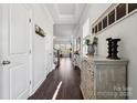 Bright entry hall with hardwood floors and a view to the living room at 1248 Thomas Knapp Pkwy, Fort Mill, SC 29715