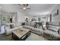 Spacious living room with sectional sofa and large TV at 179 Tanner Loop, Troutman, NC 28166