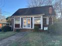 Front view of a red brick house with a small yard at 2101 Russell Ave, Charlotte, NC 28216