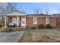 Brick home with a covered porch and landscaping at 234 Robinson St, Rock Hill, SC 29730