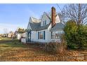 Side view of a charming house with mature landscaping at 447 Nc 16 S Hwy, Taylorsville, NC 28681