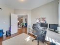 Home office with built-in desk and hardwood floors at 6608 Brookgreen Ter, Matthews, NC 28104