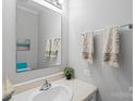 Cozy bathroom featuring neutral paint, vanity sink, and modern fixtures at 7019 Walnut Ridge Ct, Charlotte, NC 28217