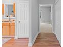 Bright hallway featuring hardwood floors and neutral paint at 7019 Walnut Ridge Ct, Charlotte, NC 28217