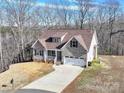 House in wooded area with large lot and driveway at 721 Red Spruce Dr, York, SC 29745