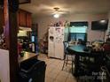 Kitchen with refrigerator, stove, and dark wood cabinets at 800 Thera Dr, Charlotte, NC 28206