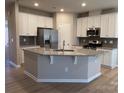 Island kitchen with stainless steel appliances and granite countertops at 9446 Avery Lilac Ln, Fort Mill, SC 29707