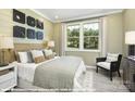 Spacious bedroom with a king-size bed, neutral decor, and large windows at 9957 Cask Way, Huntersville, NC 28078