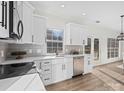 Modern kitchen with stainless steel appliances and white cabinets at 124 Lyman Oak Ct, Fort Mill, SC 29715