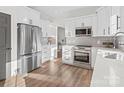 Modern kitchen with stainless steel appliances and white cabinets at 124 Lyman Oak Ct, Fort Mill, SC 29715