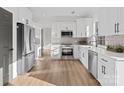 Modern kitchen with stainless steel appliances and white cabinets at 124 Lyman Oak Ct, Fort Mill, SC 29715