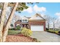 Two-story brick home with a large yard at 129 Bald Cypress Ln, Mooresville, NC 28115