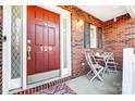 Cozy front porch with a small table and chairs at 129 Bald Cypress Ln, Mooresville, NC 28115