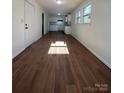 Bright living room with hardwood floors and kitchen view at 1325 Eastview Ext, Shelby, NC 28152